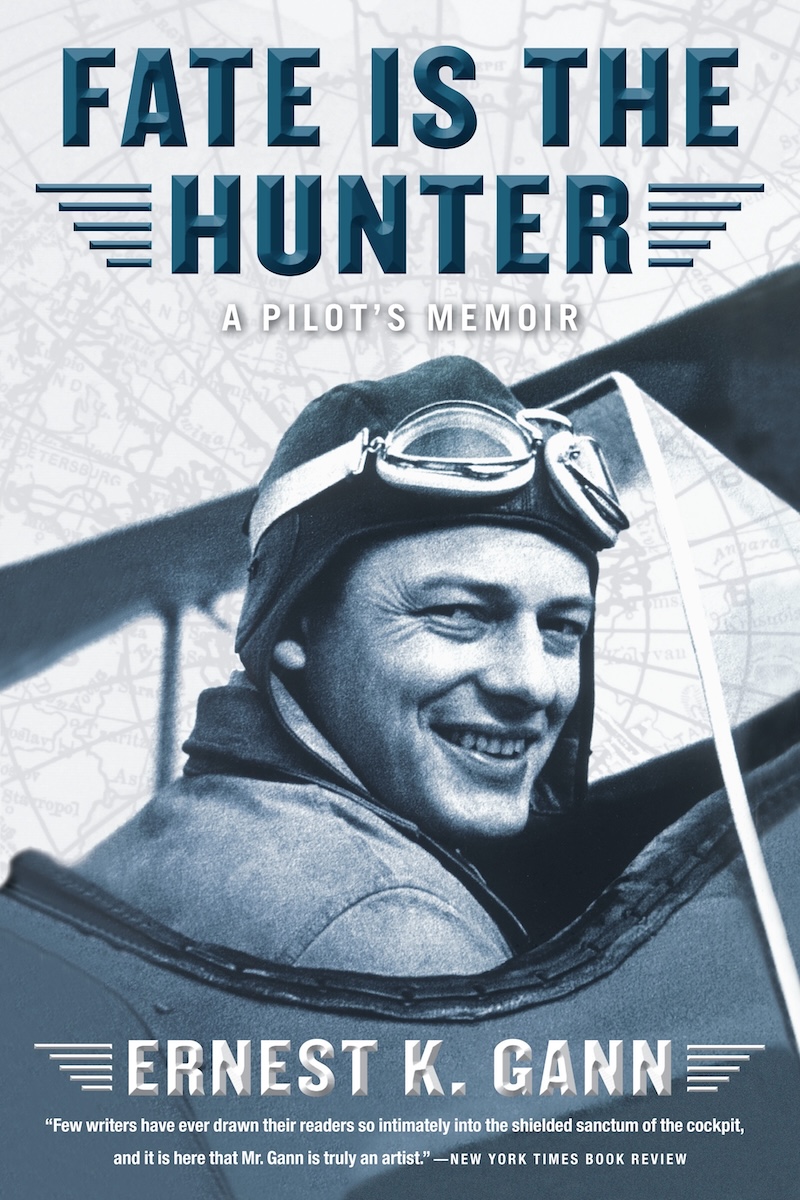 The cover of the book 'Fate is the Hunter' by Ernest K. Gann. The cover consists primarily of the author sitting in the open cockpit of a biplane. (📸 Simon & Schuster, LLC)