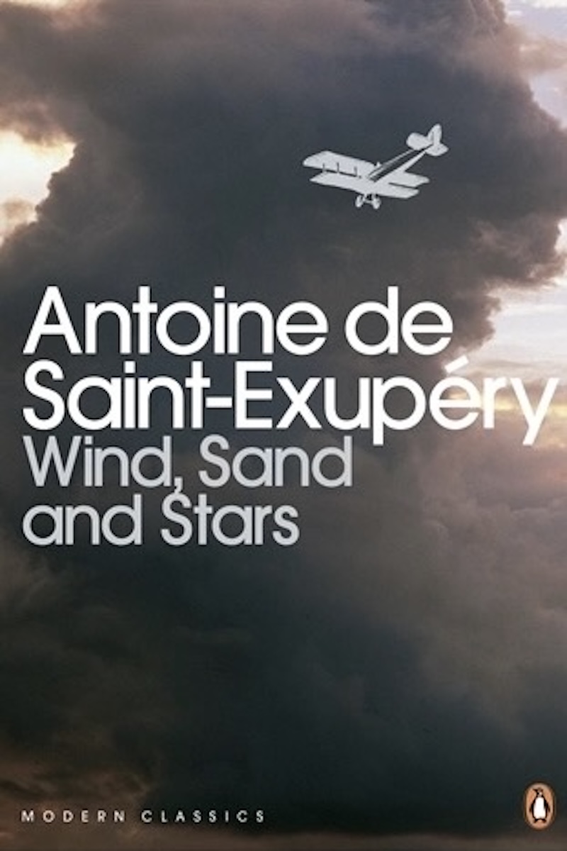 The cover of the book 'Wind, Sand and Stars’ by Antoine de Saint-Exupéry. It consists of a small rendering of a biplane as it approaches an angry-looking cloud. (📸 Penguin Books Limited)