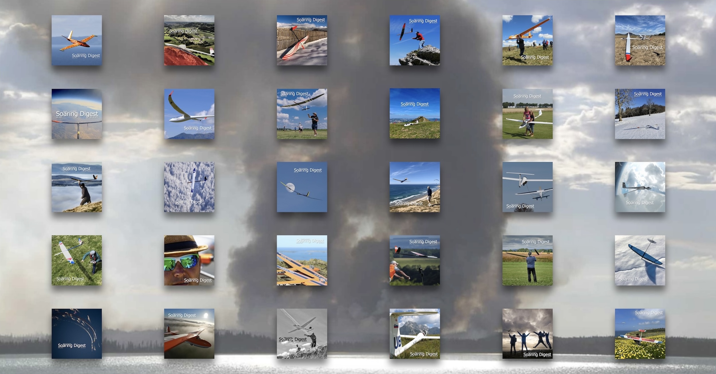 A montage of the thirty covers of the New RC Soaring Digest. Typically each of these covers shows a radio-controlled model glider along with one or more people. They are also set in spectacular landscapes. In the background is a picture of black smoke rising from a distant forest fire which is intended to reflect the line from the article which reads « as I continue to contemplate the still smoking hole in the ground that is the New RC Soaring Digest ».