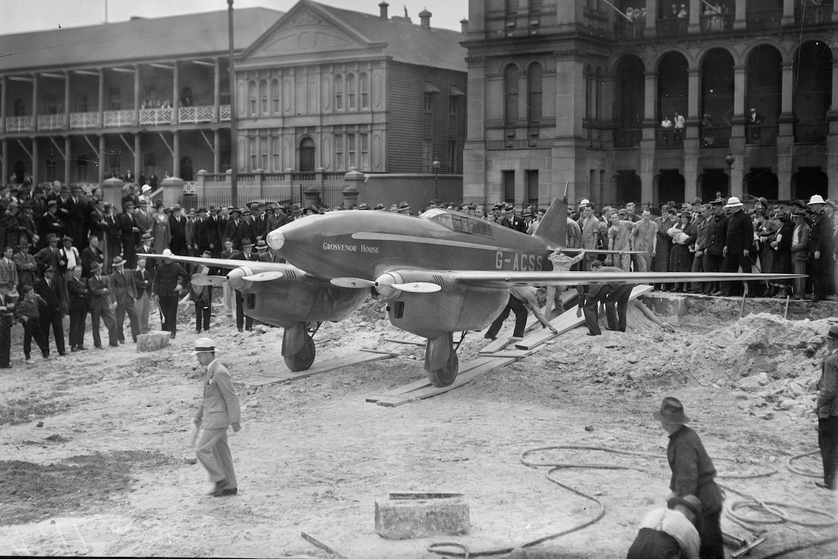 The DH.88 Comet 'Grosvenor House' being rolled into place for display outside the Sydney Hospital and Parliament in Sydney, Australia, in 1934.